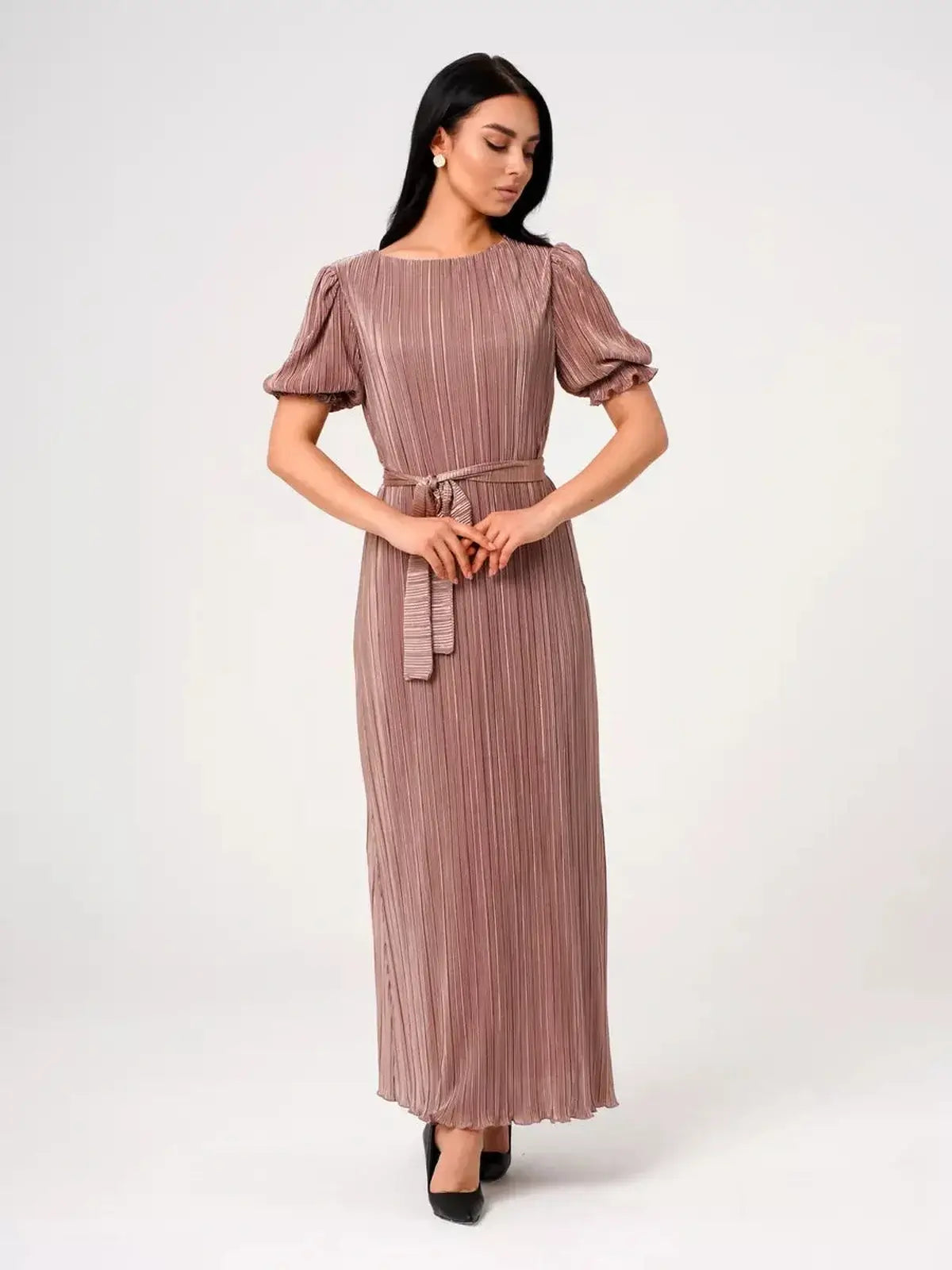 Model wearing the Noa Maxi Dress by Lauven, showcasing elegant pleats and puff sleeves in a cappuccino hue.