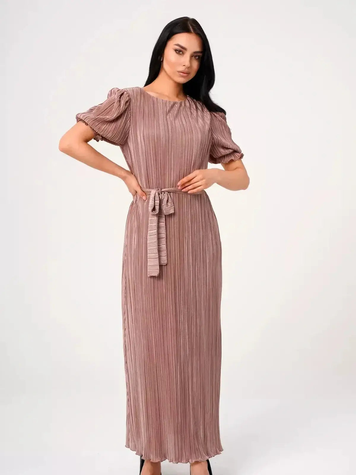 Noa Maxi Dress featuring elegant pleats, puff sleeves, and a soft cappuccino hue for modern occasionwear.