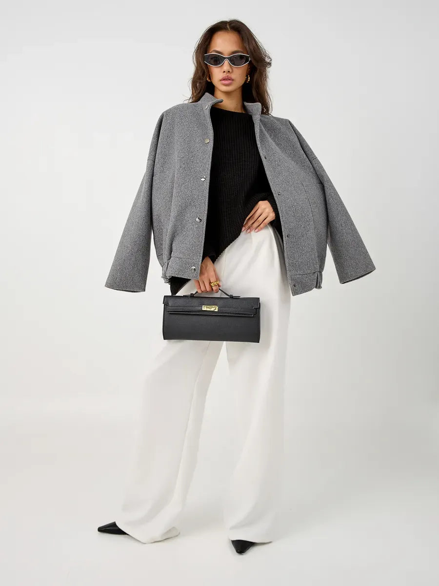 Nola Sweater styled with oversized gray jacket and chic accessories from Lauven for a trendy winter look.