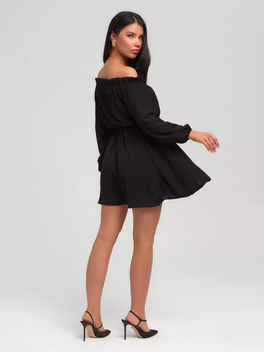 Nova Mini Dress by Lauven – Elegant off-shoulder black mini dress showcasing a flowing silhouette.