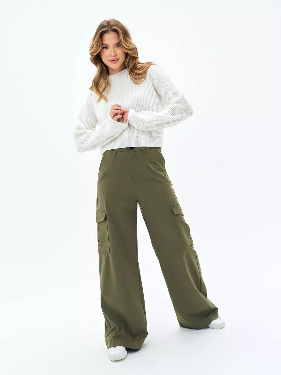 Nova Sweater by Lauven – White oversized knit paired with stylish cargo pants for casual elegance.