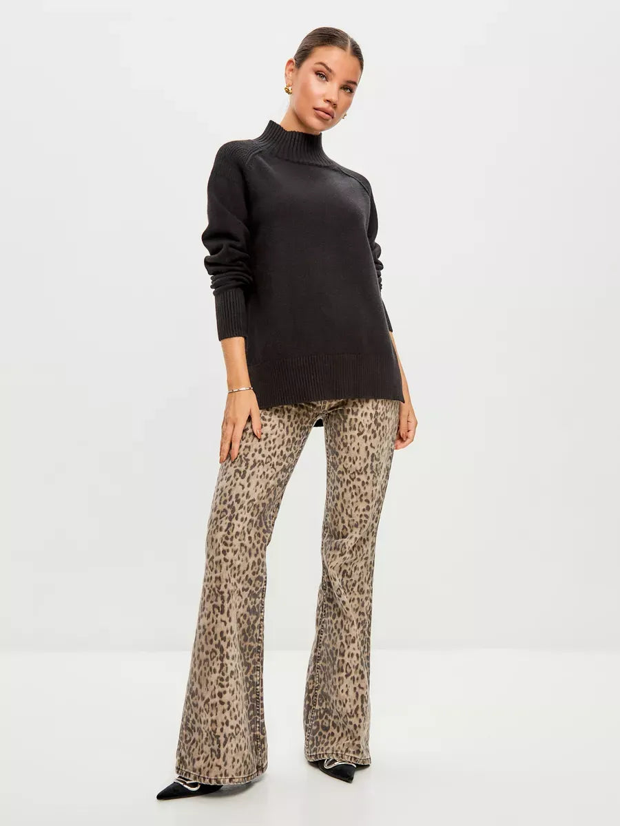 Onyx Sweater by Lauven, oversized black cashmere blend with high neck, styled with leopard print flared pants.