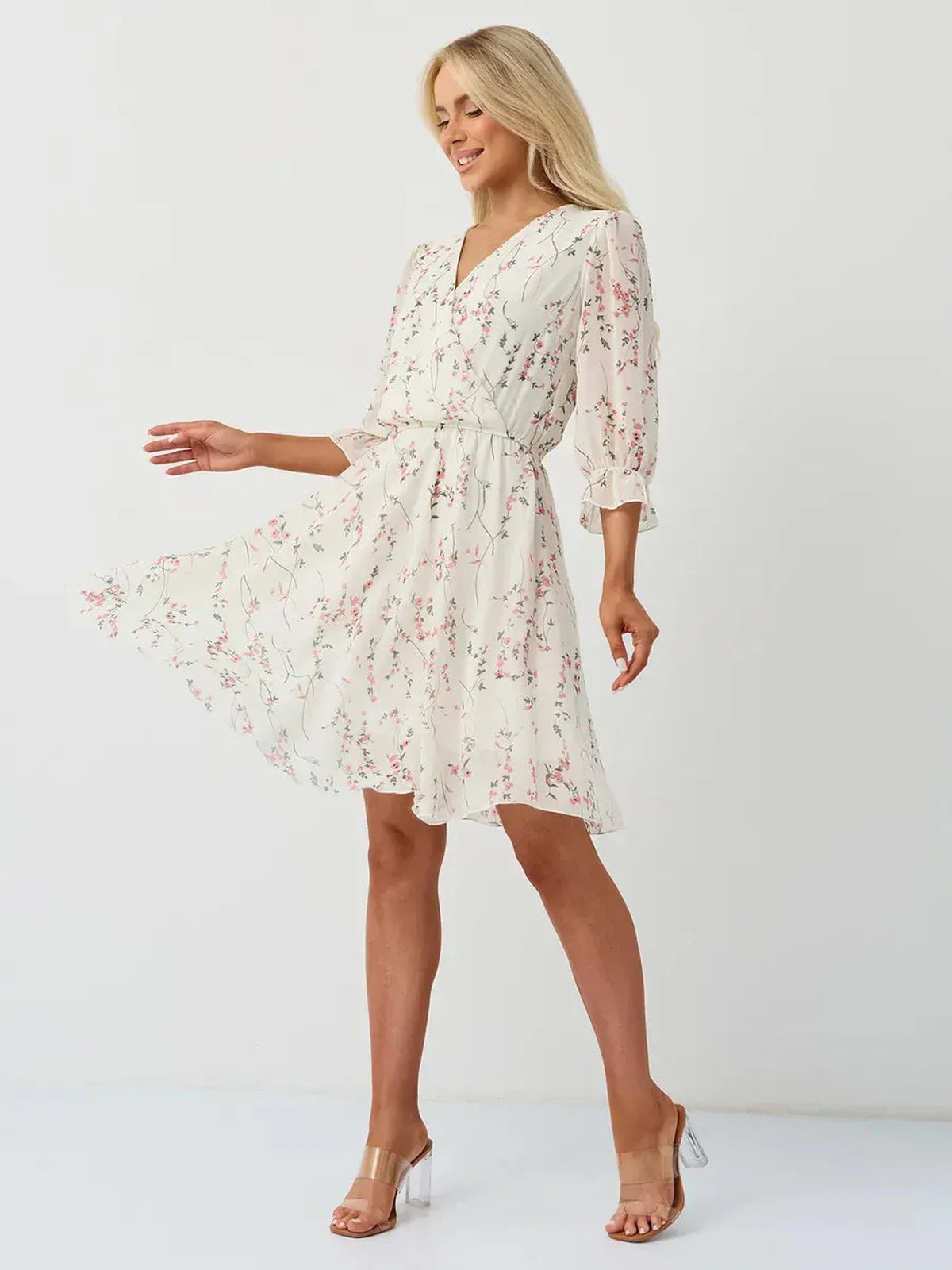 Petunia Mini Dress by Lauven, white floral wrap dress with V-neckline and three-quarter sleeves.