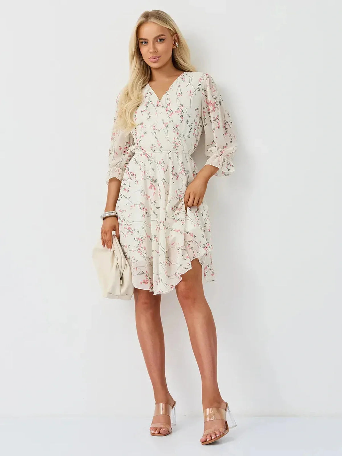 Petunia Mini Dress by Lauven, white floral wrap dress with V-neckline and ruffled sleeves.