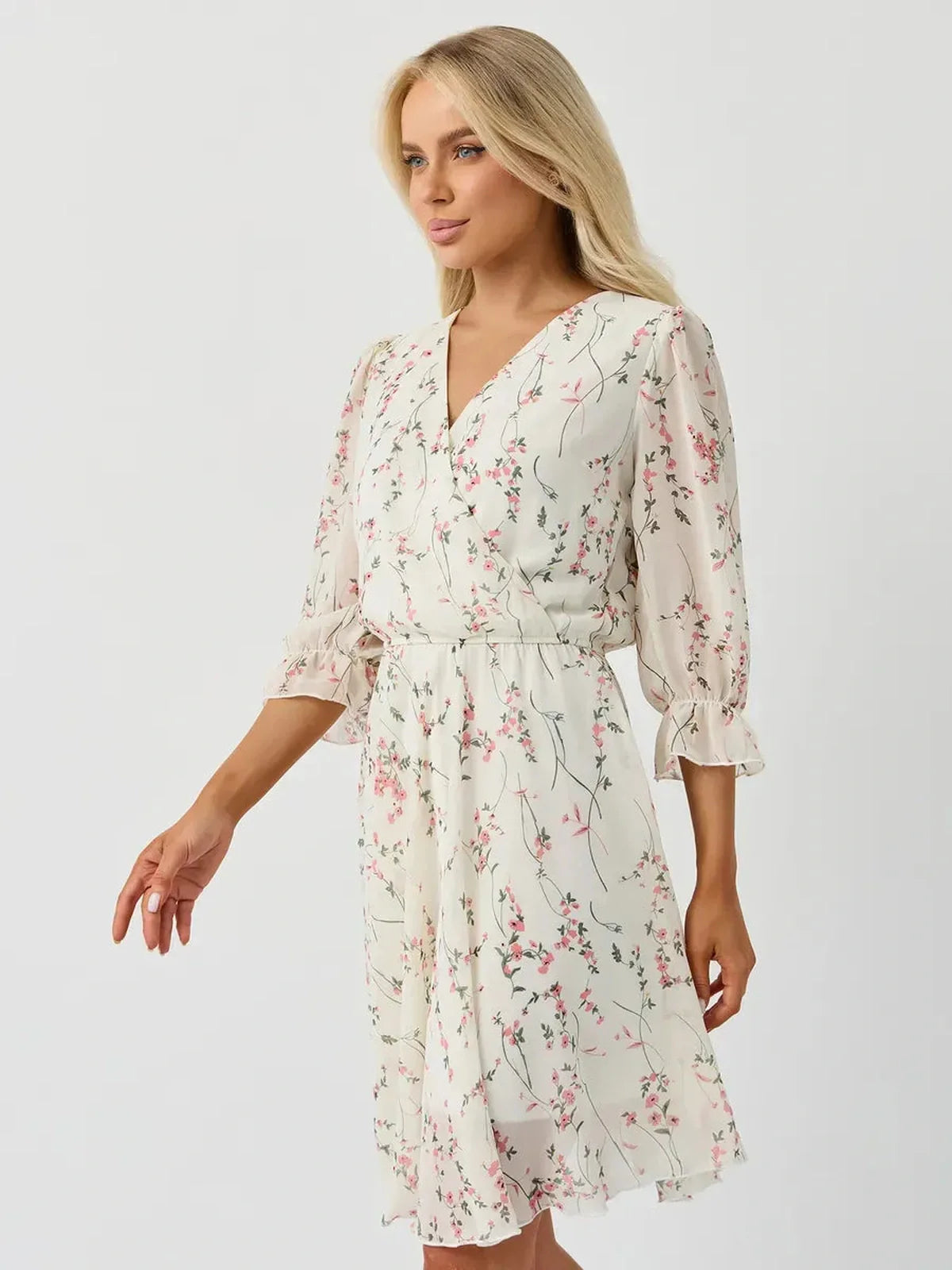 Petunia Mini Dress by Lauven, white floral wrap dress with V-neckline and three-quarter ruffled sleeves.