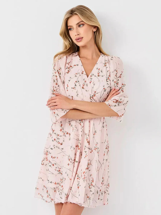 Primrose Mini Dress by Lauven, a pink floral wrap dress with V-neckline and 3/4 puff sleeves.