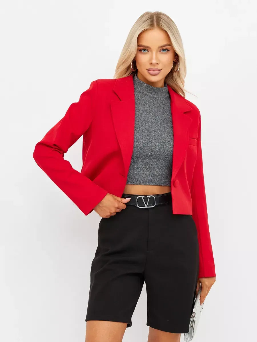 Ruby Blazer by Lauven worn with a gray top and black shorts, showcasing modern red elegance.