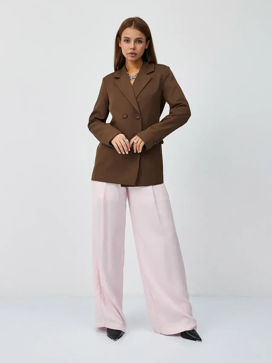 Saffron Blazer by Lauven, an elegant oversized double-breasted chocolate blazer, styled with wide pink trousers.
