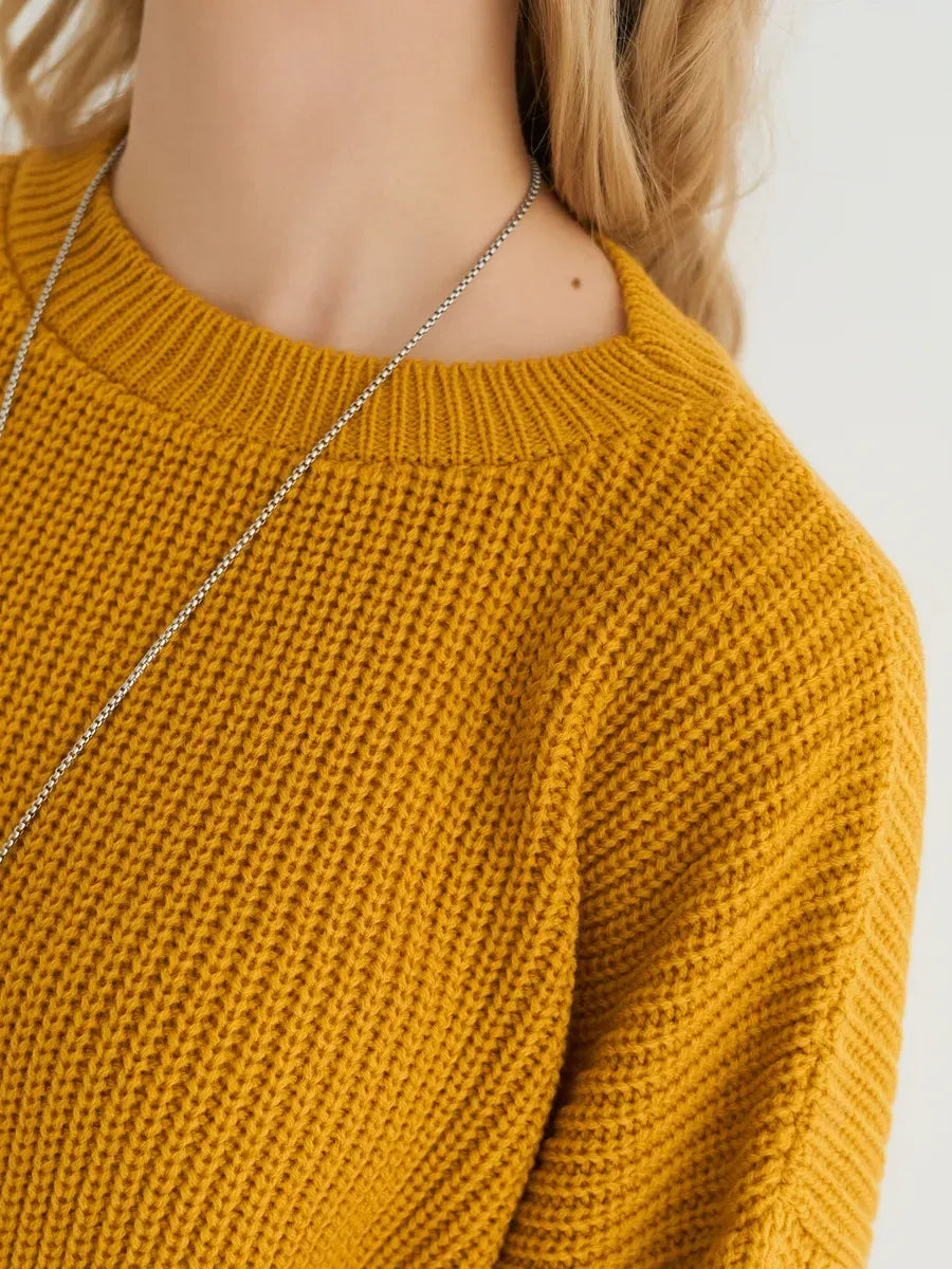 Solara Sweater by Lauven, oversized knit in vibrant mustard yellow, showcasing a modern ribbed texture and relaxed fit.