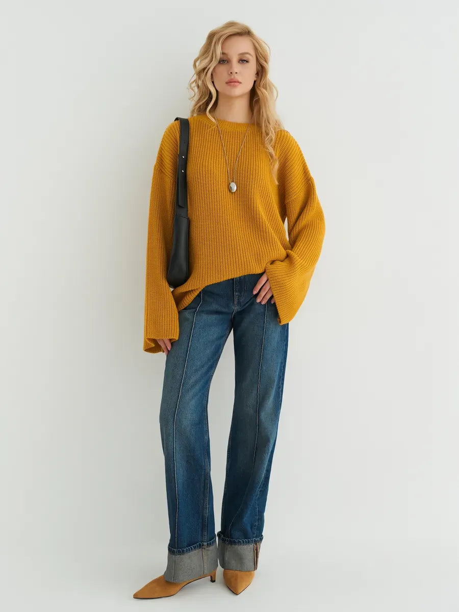 Solara Sweater by Lauven in mustard yellow, oversized knit paired with jeans, perfect for a stylish look.
