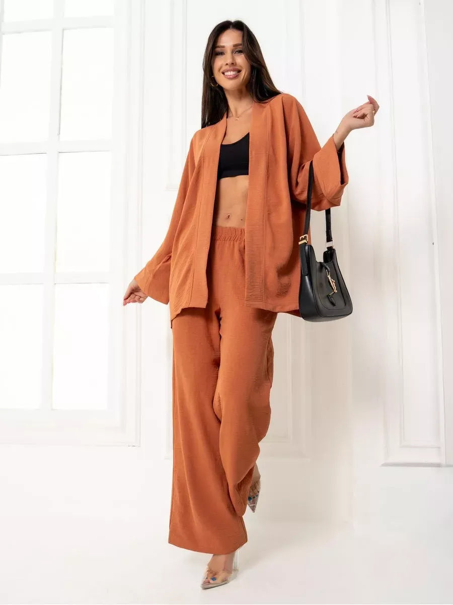 Terracotta Suit Set by Lauven, featuring an elegant oversized two-piece set in warm brown with wide-leg pants.