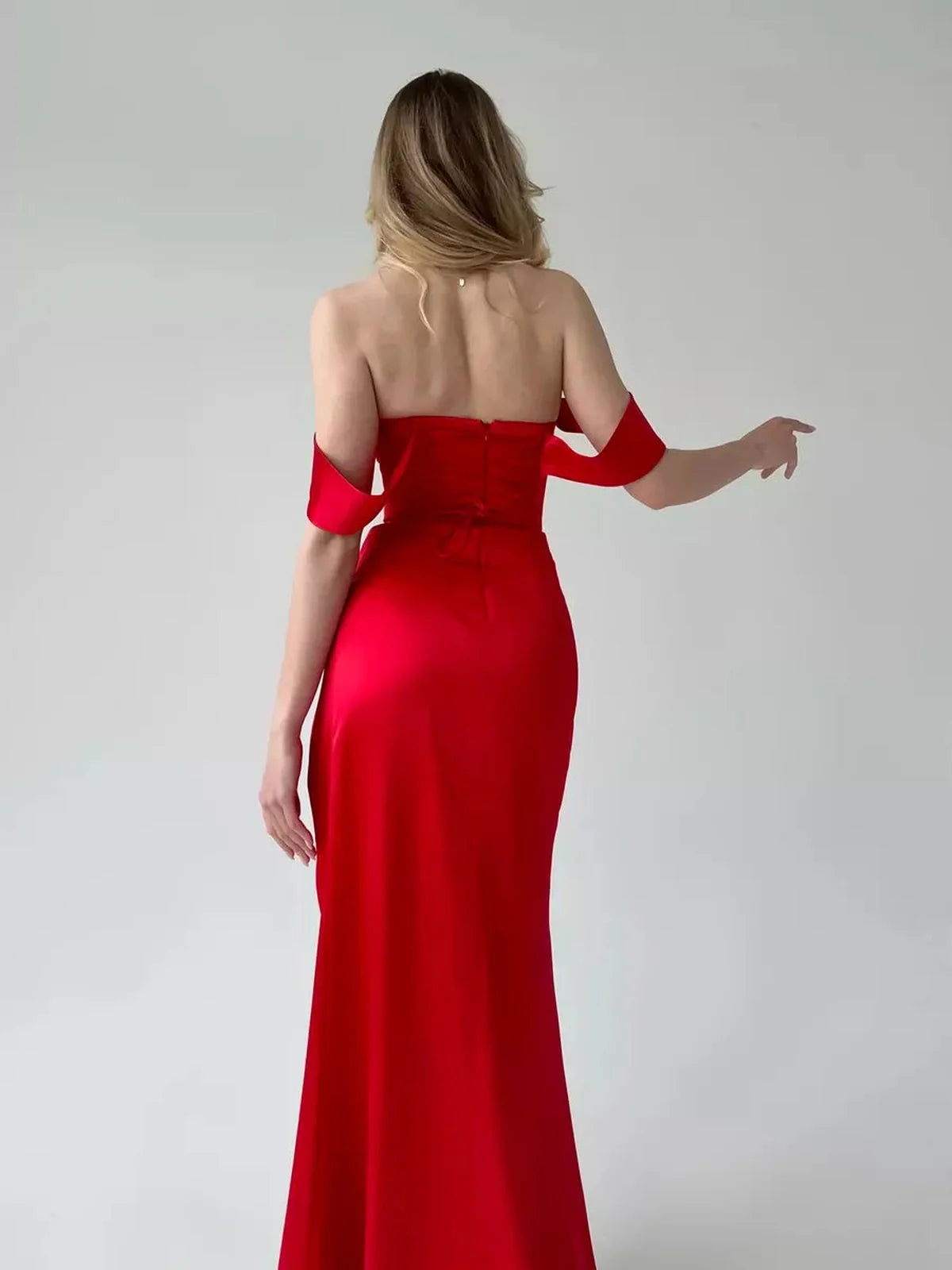 Vega Party Dress by Lauven, red satin off-shoulder gown showcasing an elegant back design and fitted silhouette.