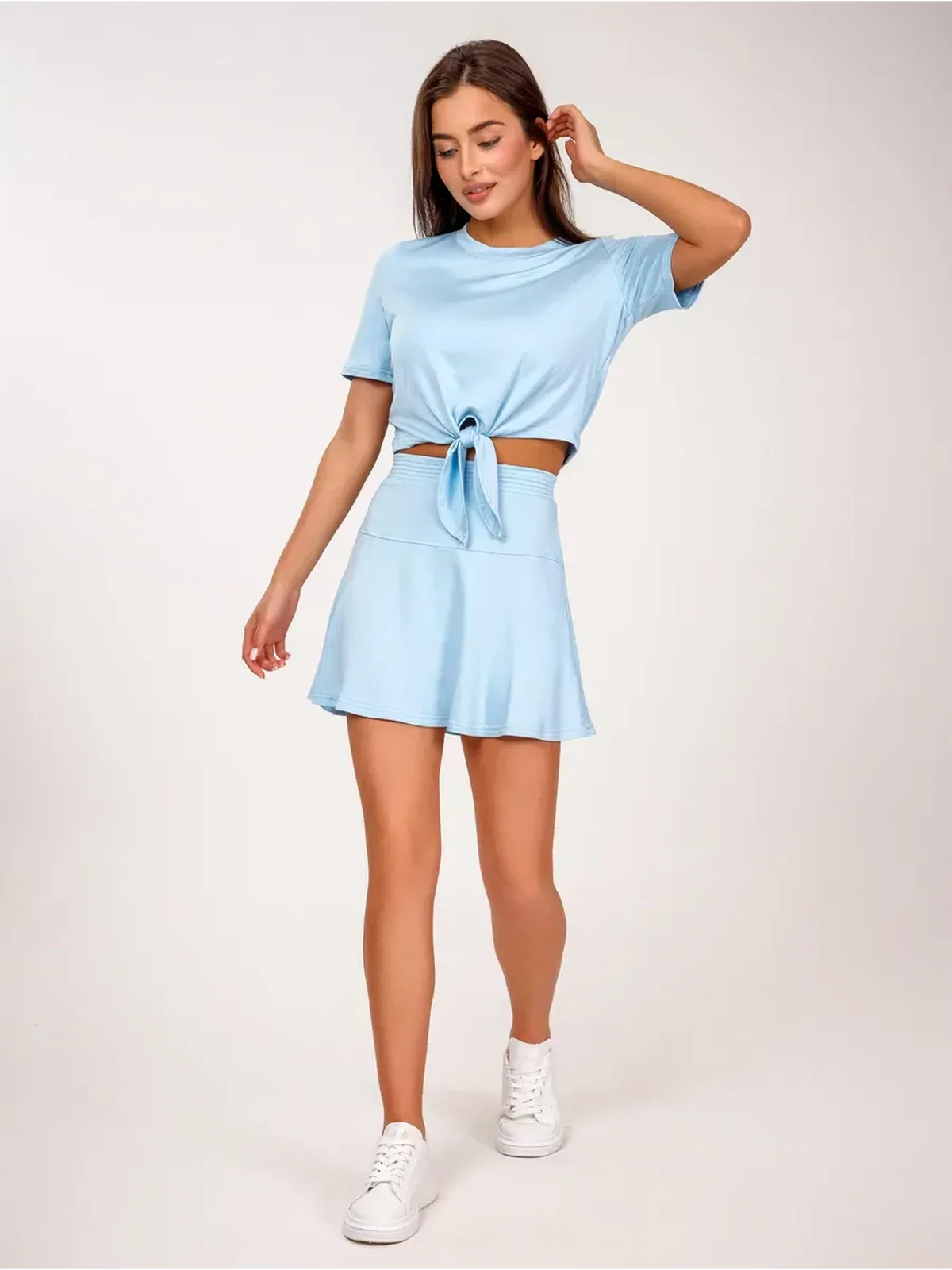 Vivienne Set by Lauven – Ice blue two-piece with flared skirt, featuring a cropped top and adjustable front tie.