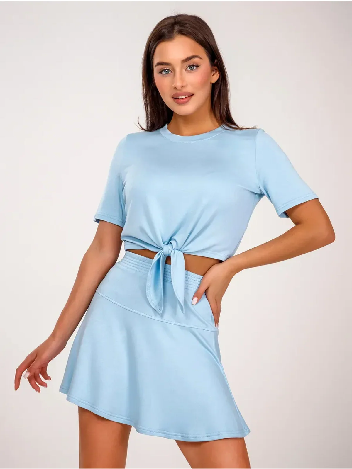 Vivienne Set by Lauven in ice blue showing a cropped top with tie and flared skirt.