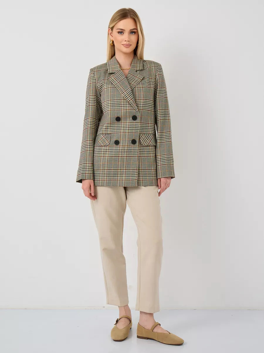 Model wearing a Maple Blazer by Lauven, an elegant oversized brown checked women's blazer.