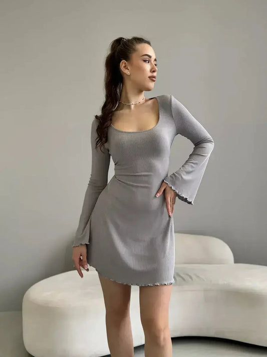 Amelia Mini Dress by Lauven in gray ribbed knit with long bell sleeves and tie-back detail.