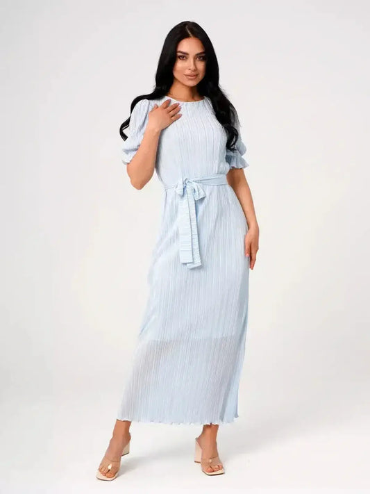 Angel Maxi Dress in light blue with pleats and waist tie, showcasing a romantic and elegant silhouette.