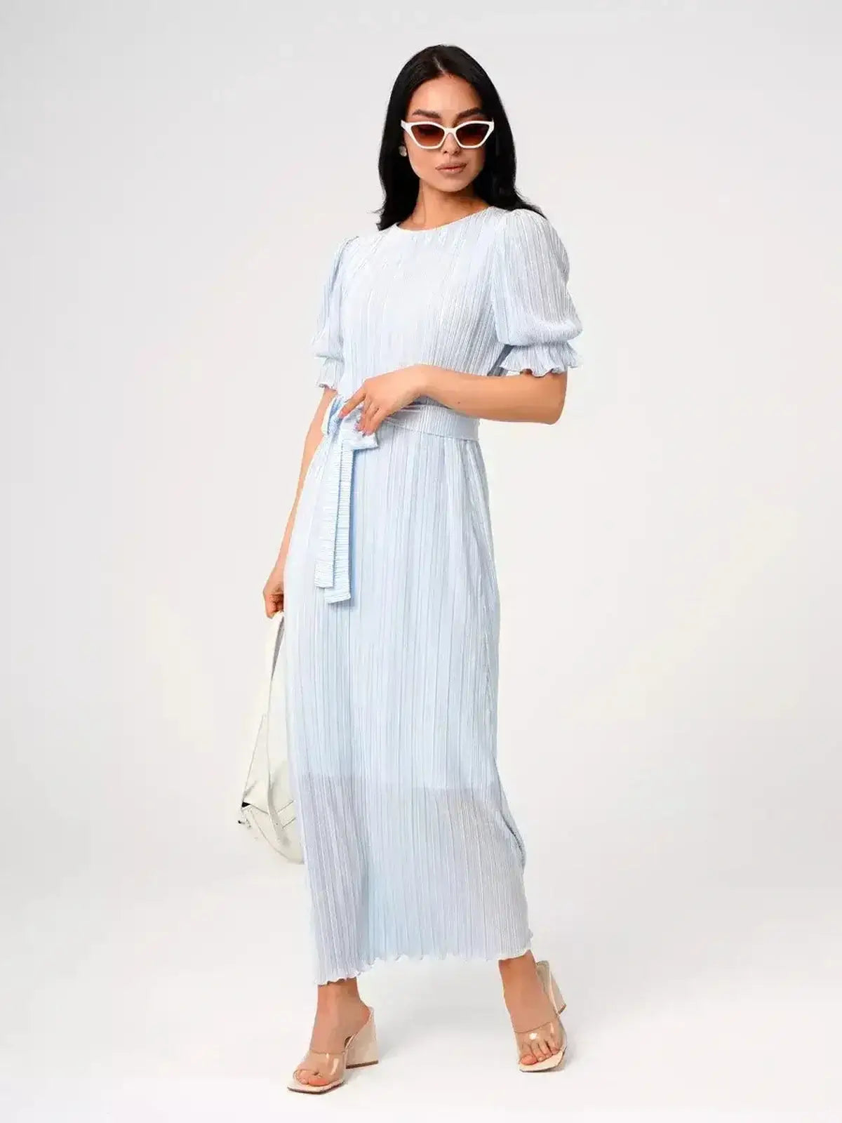 Angel Maxi Dress in light blue with pleats and waist tie, exuding elegance and sophistication for warm-weather occasions.