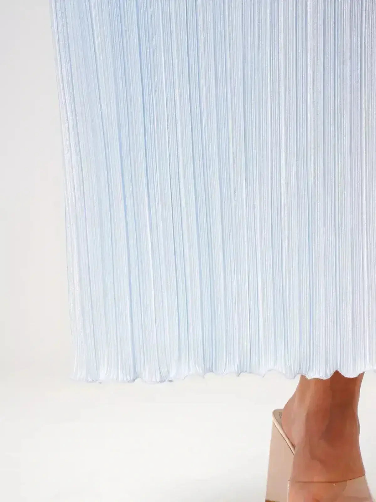 Angel Maxi Dress in light blue featuring pleated fabric and a delicate hem, showcasing elegance and style.