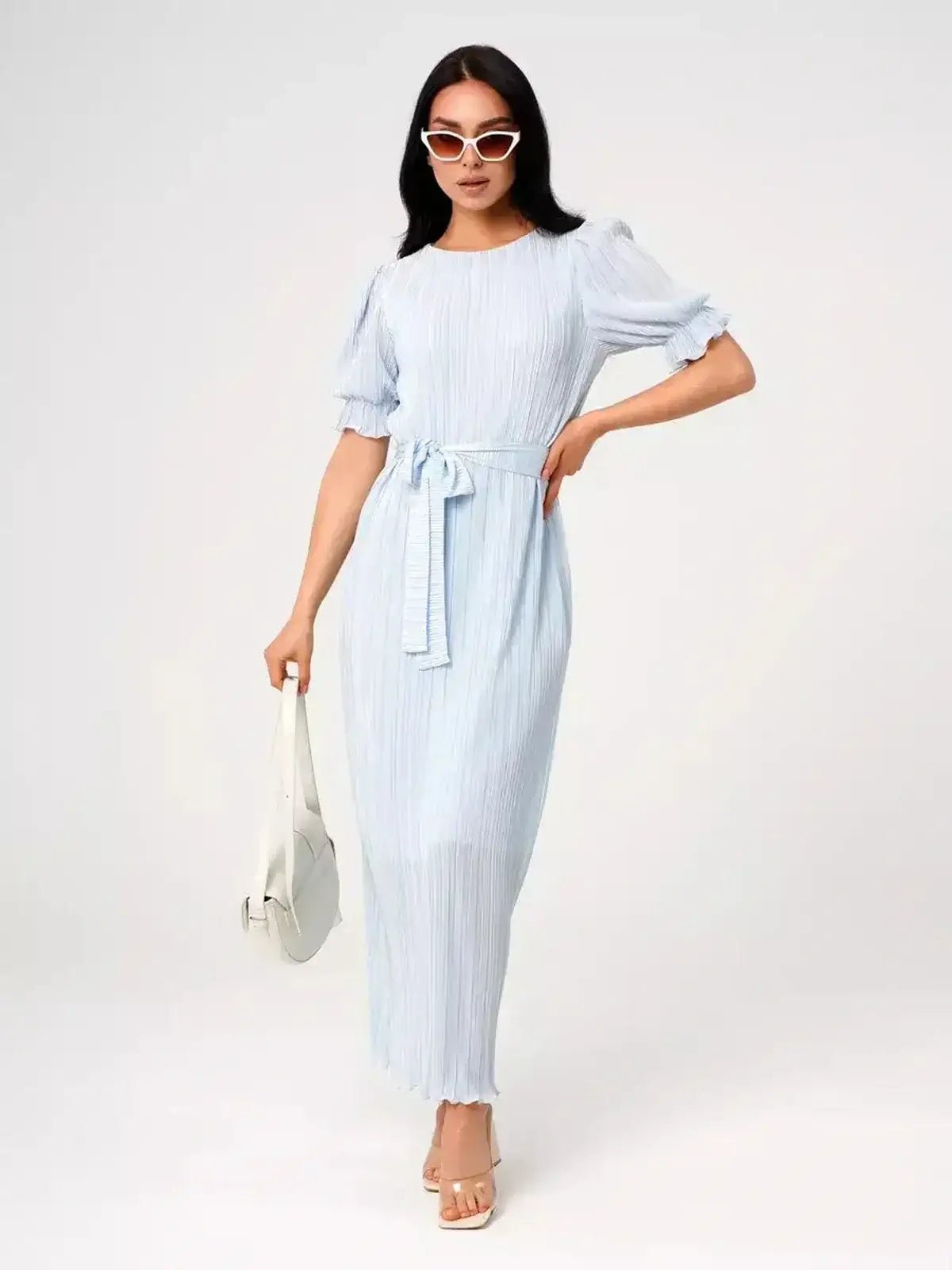 Angel Maxi Dress – Light blue pleated elegance with a waist tie and puff sleeves, perfect for warm weather.