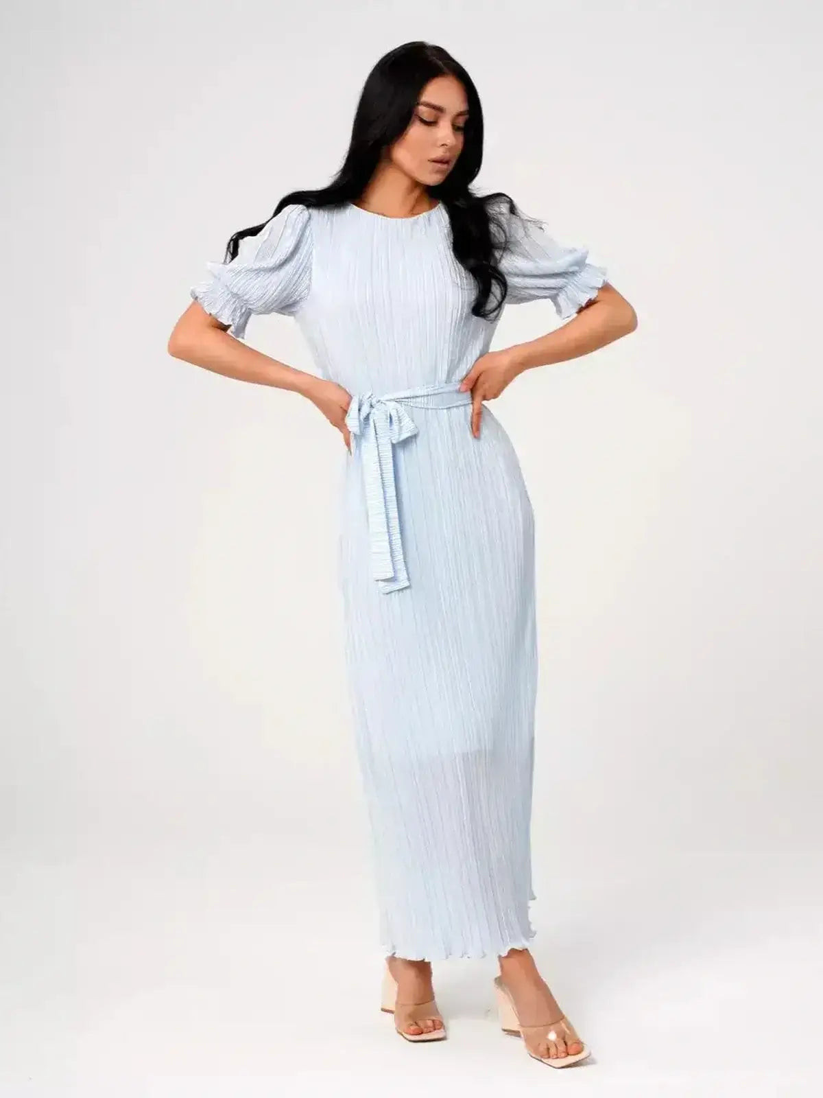 Angel Maxi Dress – Light blue pleated design with self-tie waistbelt and puff sleeves for a romantic look.