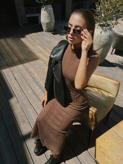 Model wearing Lauven Aurora Maxi Dress, a sleeveless knit bodycon gown with a fitted silhouette and high neckline.