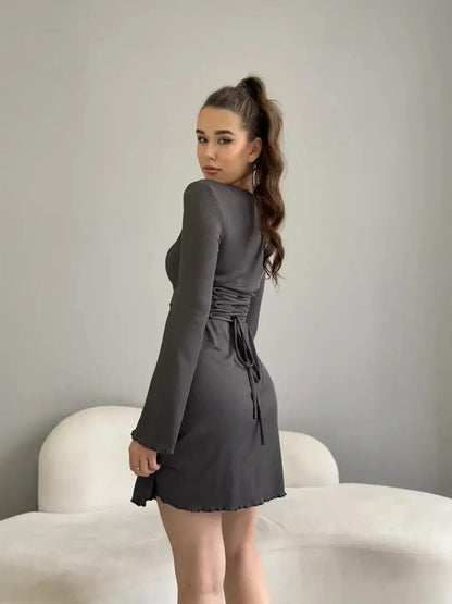 Ava Mini Dress by Lauven, ribbed knit, long sleeve, square neckline, bell sleeves, back tie in gray.