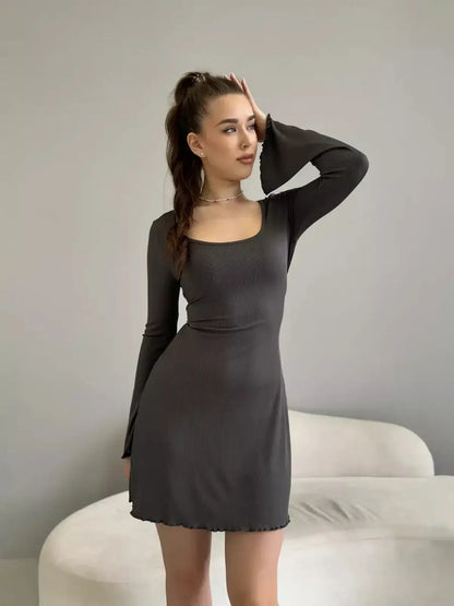 Ava Mini Dress by Lauven – Ribbed knit long sleeve dress with square neckline and bell sleeves.