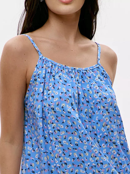 Azure Mini Dress by Lauven featuring a vibrant blue floral print and delicate spaghetti straps for summer style.