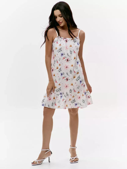 Blossom Mini Dress by Lauven featuring a soft cotton open back and colorful floral print design.