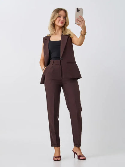 Cacao Suit Set by Lauven featuring a sleeveless chocolate vest and high-waist pants for a chic modern look.