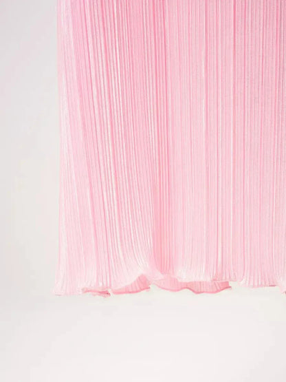 Candy Maxi Dress featuring soft pleated pink fabric for a flowy and feminine look.