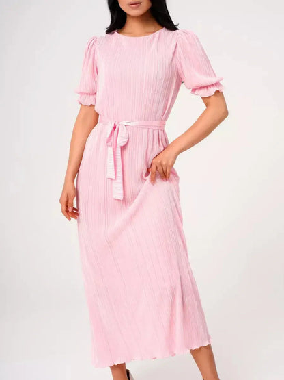 Candy Maxi Dress featuring pleated design, puff sleeves, and tie waist in soft pink hue.