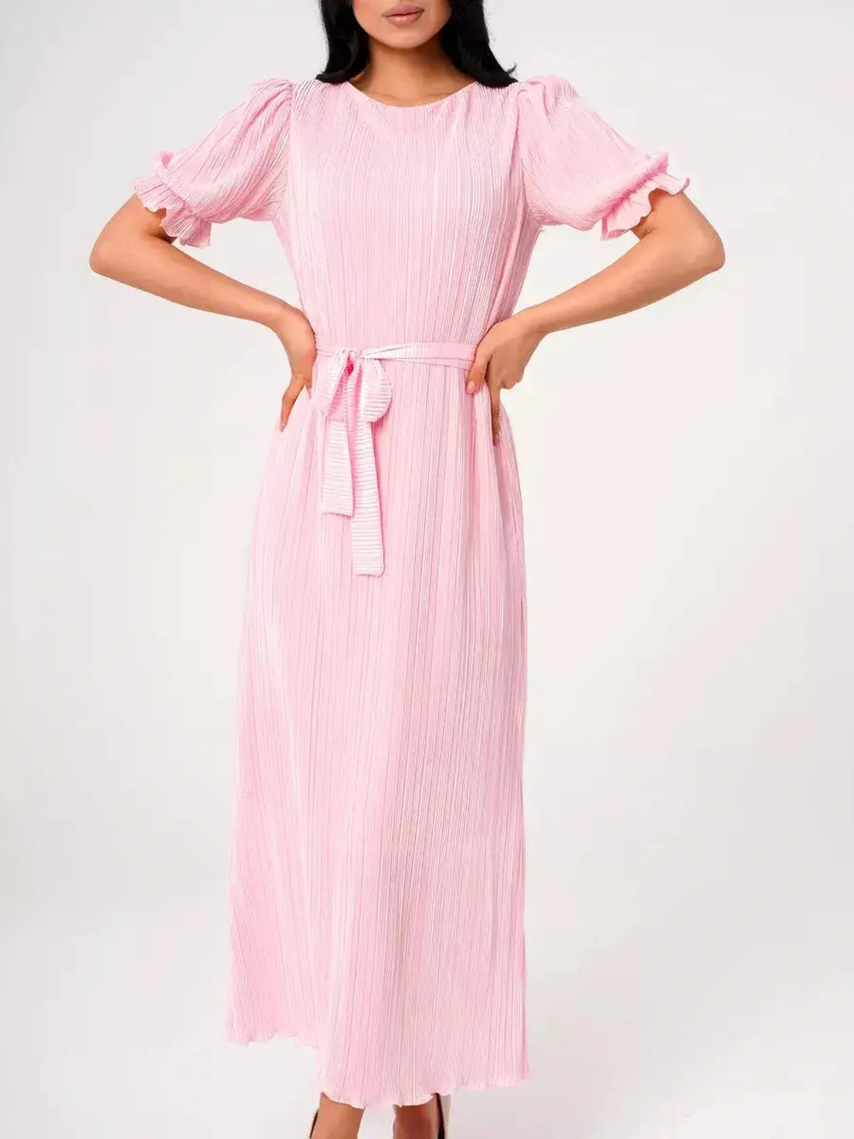 Candy Maxi Dress showcasing pleated elegance, puff sleeves and a tie waist in a soft pink hue.