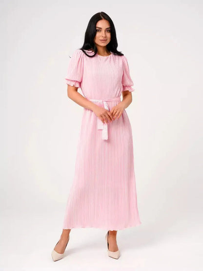 Candy Maxi Dress in pink, featuring pleated elegance, puff sleeves, and a tie waist for a timeless feminine look.
