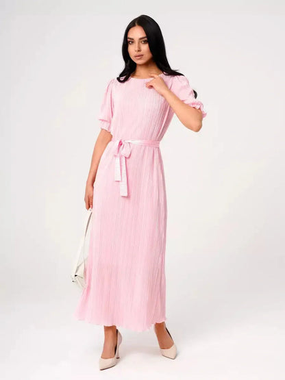 Candy Maxi Dress featuring pleated elegance, puff sleeves, and a tie waist in soft pink color.