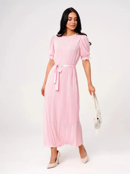 Candy Maxi Dress in soft pink with pleated design, puff sleeves, and tie waist for a refined, feminine look.
