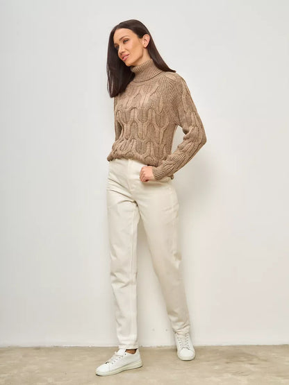 Cappuccino Knitwear by Lauven, oversized wool-blend turtleneck sweater styled with cream pants.