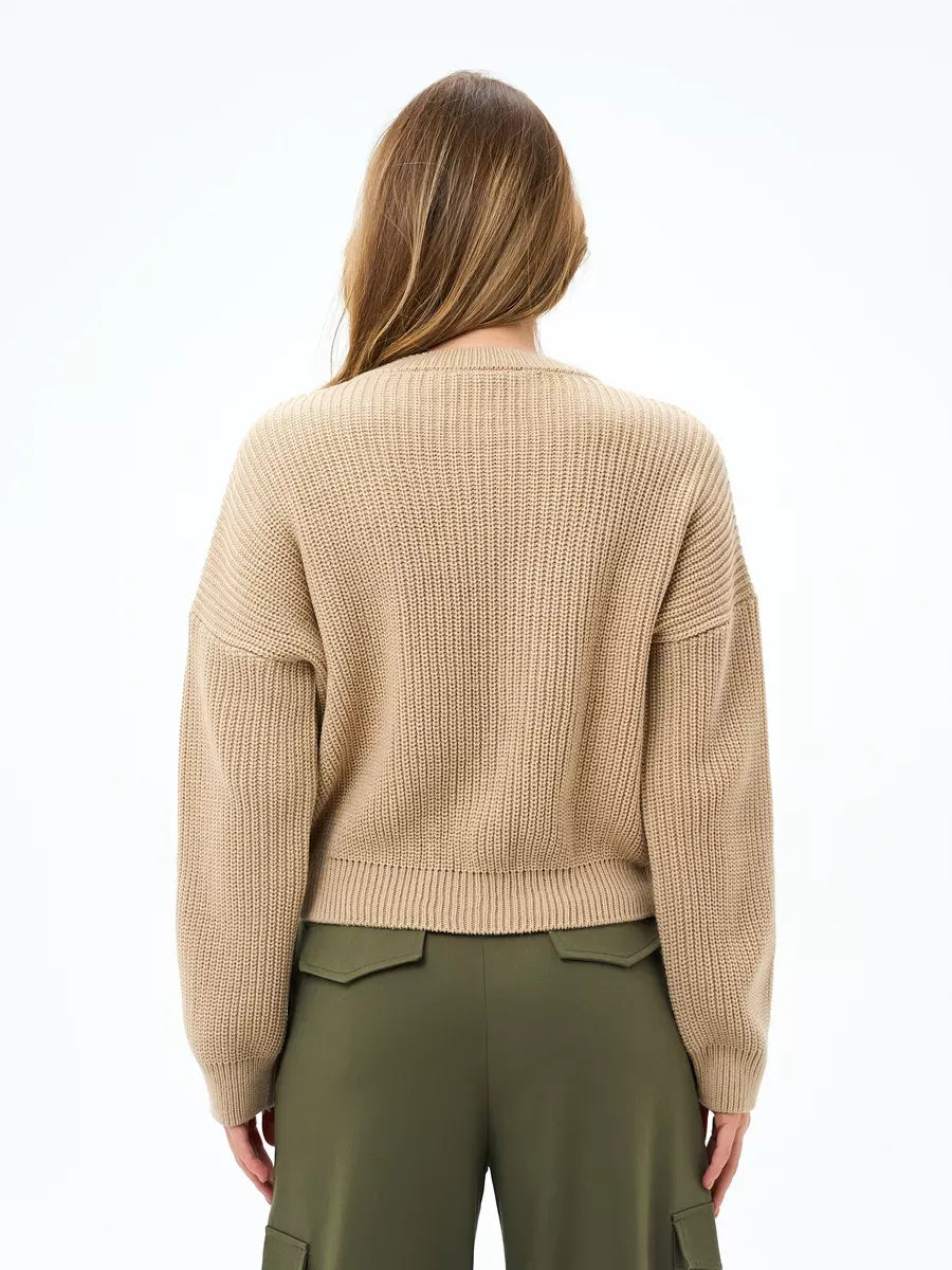 Back view of the Lauven Cappuccino Sweater, an oversized knit in warm beige, showcasing its relaxed silhouette.