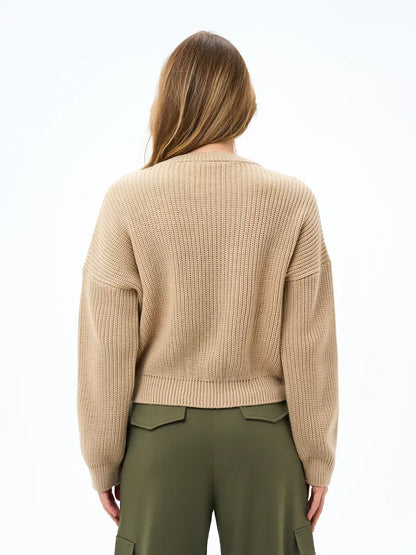 Back view of the Lauven Cappuccino Sweater, an oversized knit in warm beige, showcasing its relaxed silhouette.