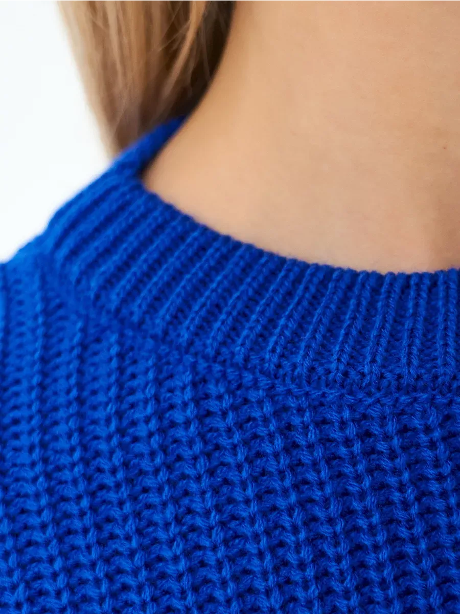 Close-up of the neckline of the Capri Sweater by Lauven in vibrant electric blue knit texture.