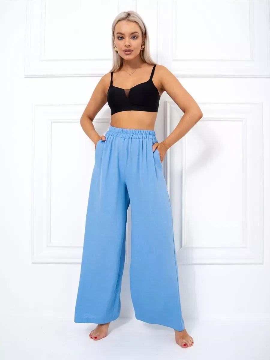 Celeste Suit Set by Lauven - Elegant oversized palazzo pants in soft blue, styled with a black crop top.