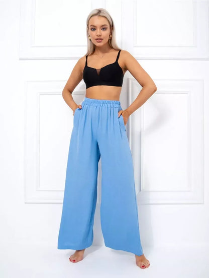 Celeste Suit Set by Lauven - Elegant oversized palazzo pants in soft blue, styled with a black crop top.