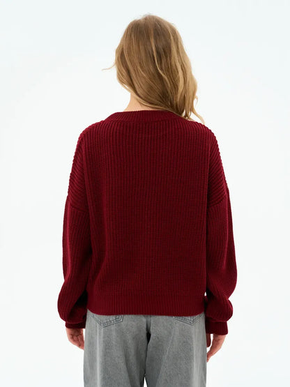Back view of the Crimson Charm Sweater by Lauven in deep burgundy, showcasing its oversized knit and relaxed silhouette.