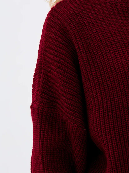 Close-up of a Crimson Pullover by Lauven, featuring a textured burgundy knit design and oversized fit.
