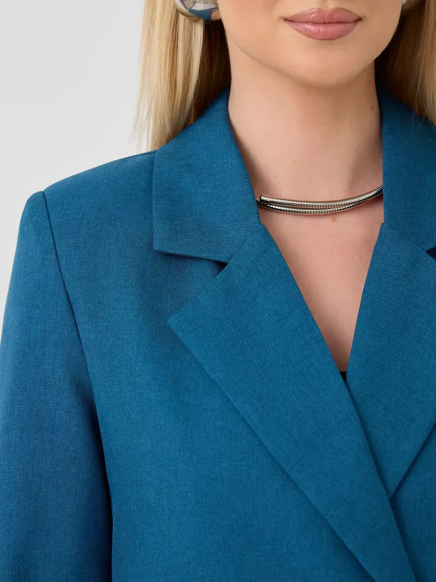 Diana Blazer by Lauven, showcasing a close-up of the stylish collar and neckline detail in a vibrant blue fabric.