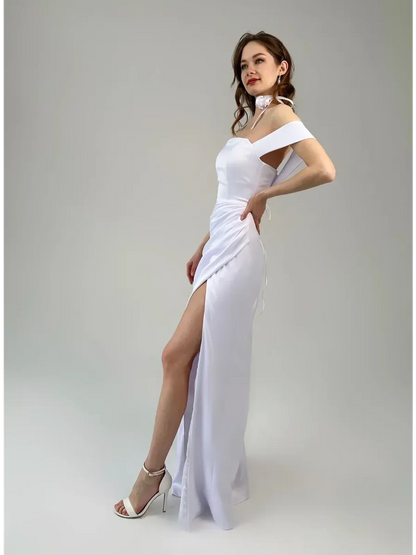 Eira Occasion Dress by Lauven – Elegant white satin off-shoulder gown with draping and high leg slit.