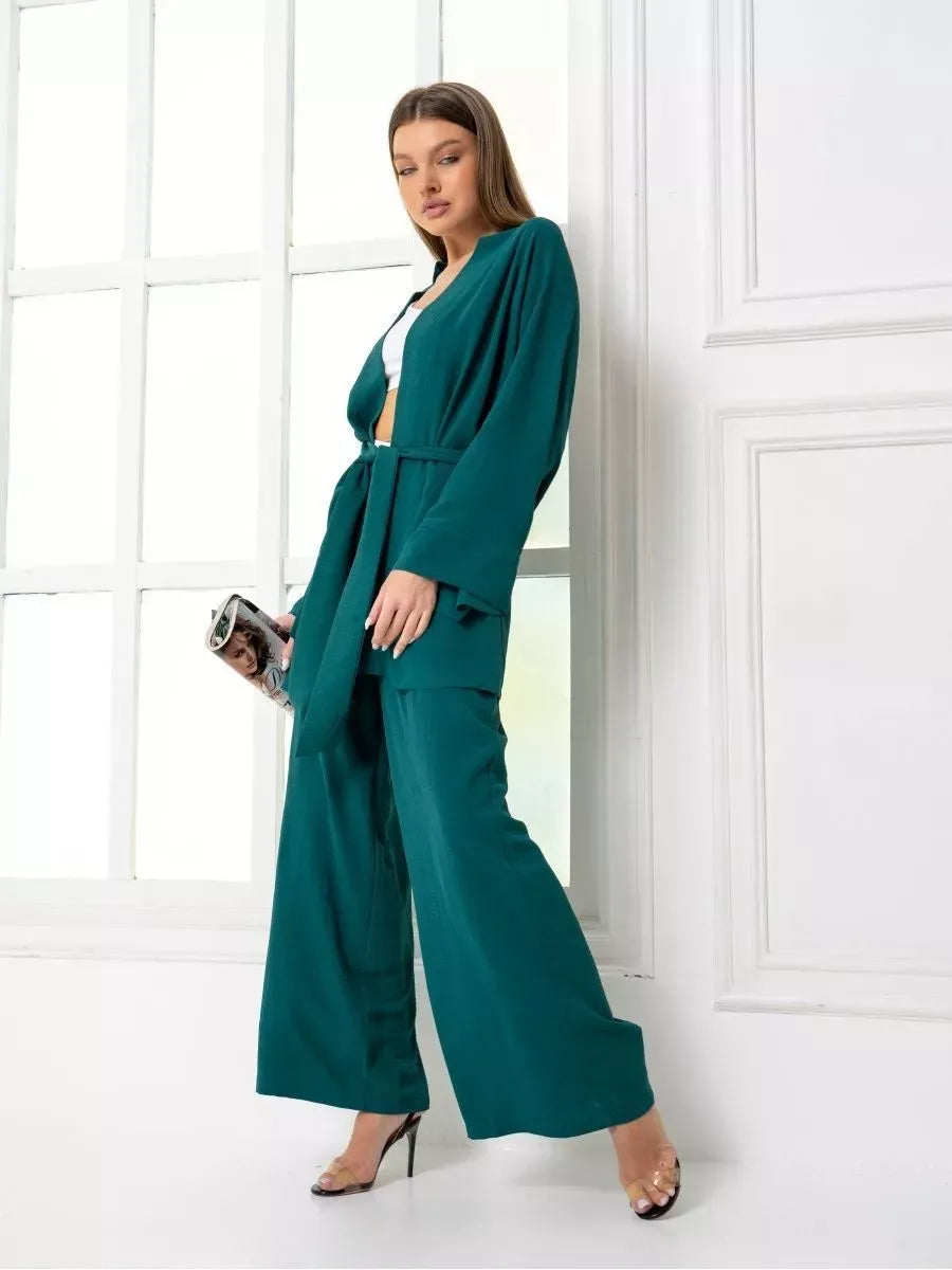 Emerald Suit Set modeled by a woman in a luxurious green oversized two piece set from Lauven.