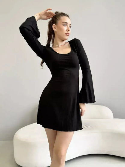 Emily Mini Dress by Lauven, black ribbed knit, long sleeve with square neckline and flared cuffs.