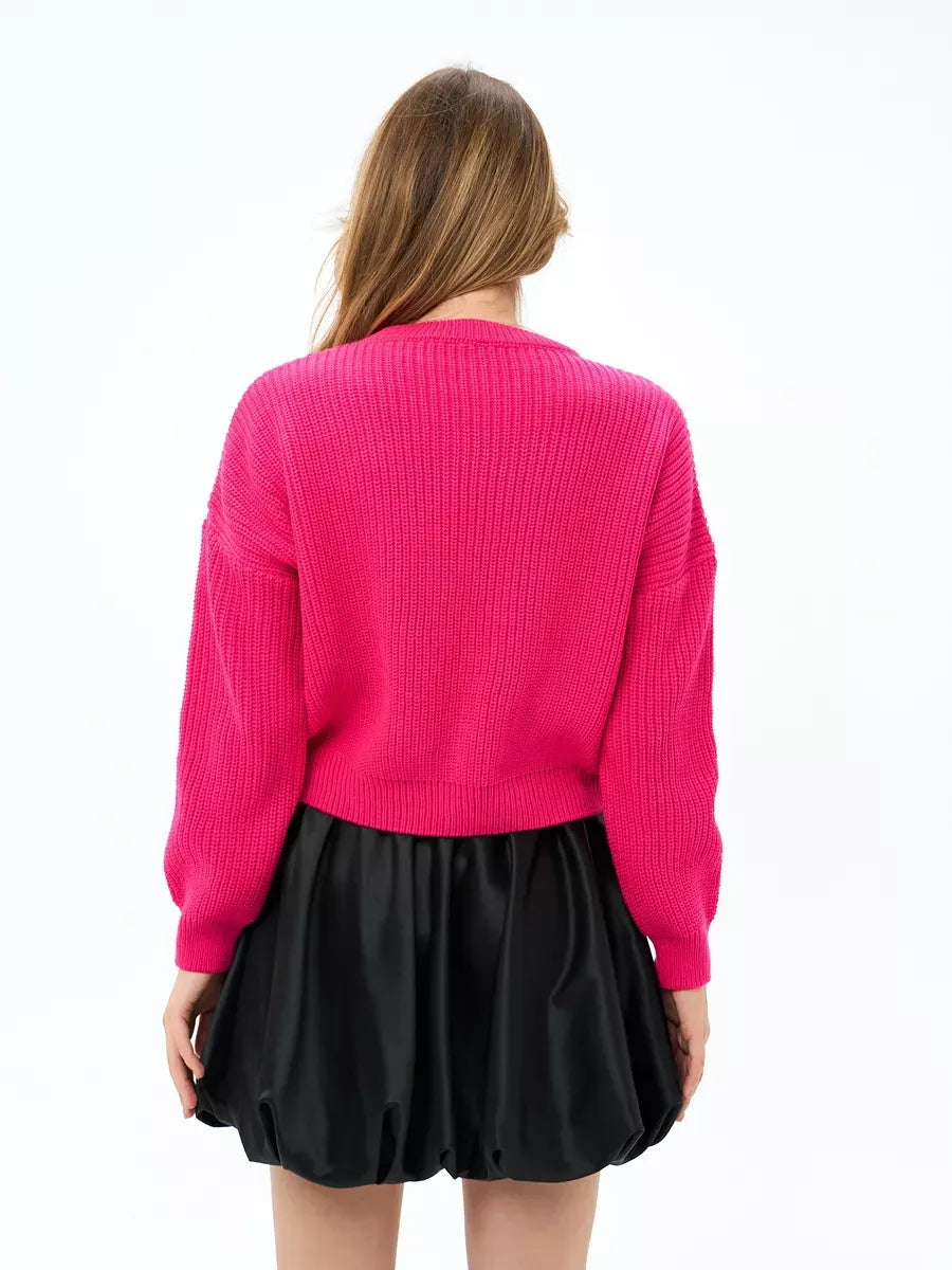 Flamingo Sweater by Lauven, oversized knit in bold fuchsia, showcasing cozy back view with stylish skirt.